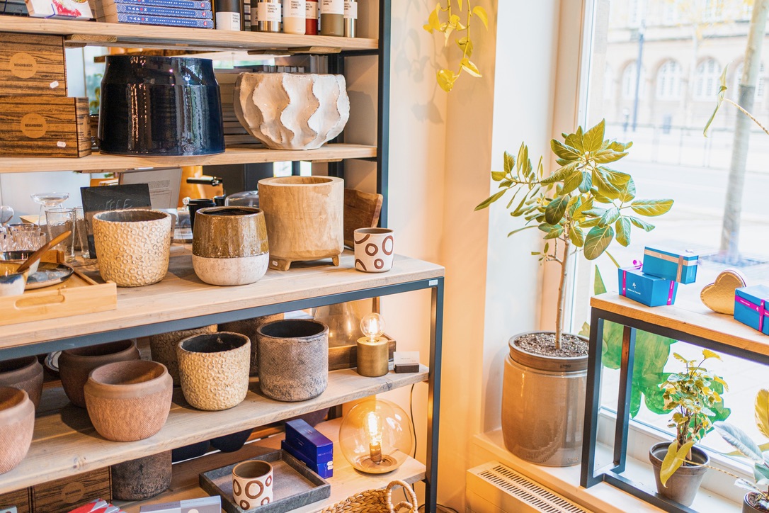Ceramic pots, glass lamps and decorative objects on the shelves at Market By Jeremy